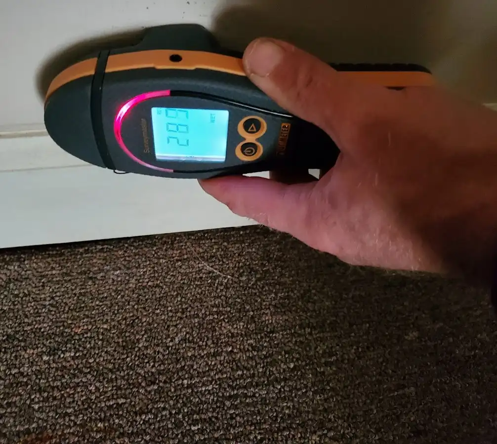 Moisture detection at baseboard during Storm Damage Restoration in Saddlebrooke